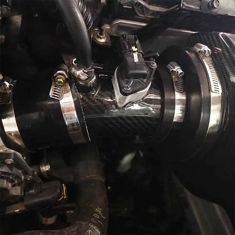 Close-up of carbon fiber Atenza air intake tube installed on Mazda PY 2.5L